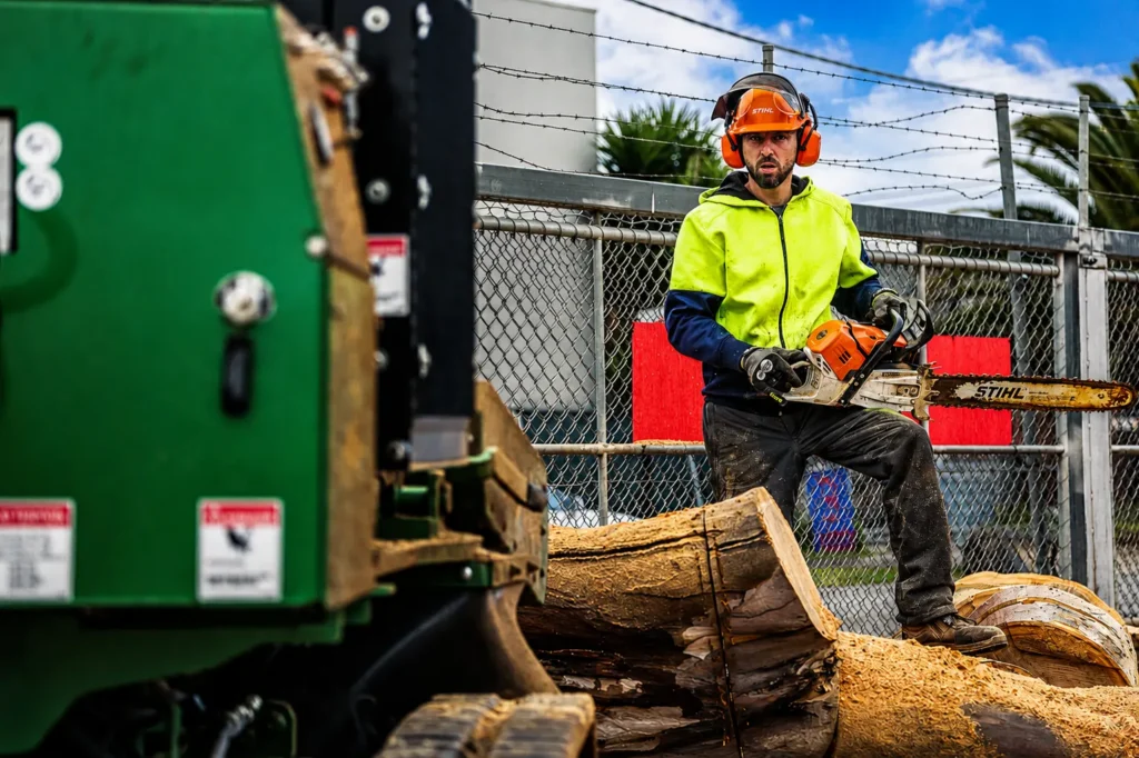 Local Melbourne tree pruning crew loading branches for green waste recycling